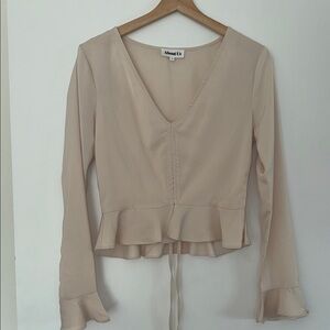 About us  Women's Cream Ruffle Blouse